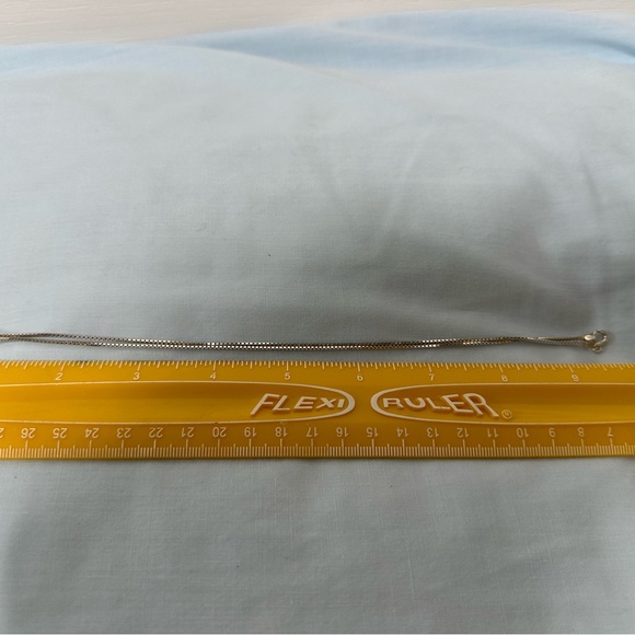 Silver pendant with gold star on the front and an arrow on the back. - Picture 4 of 5